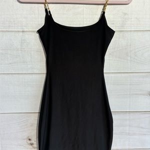 Black bodycon mini dress with chain straps